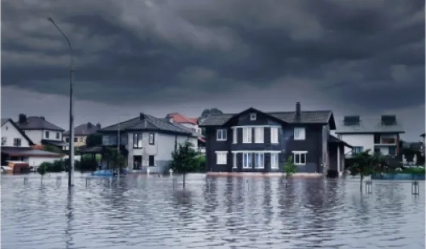 Flooded suburban neighborhood under heavy storm clouds